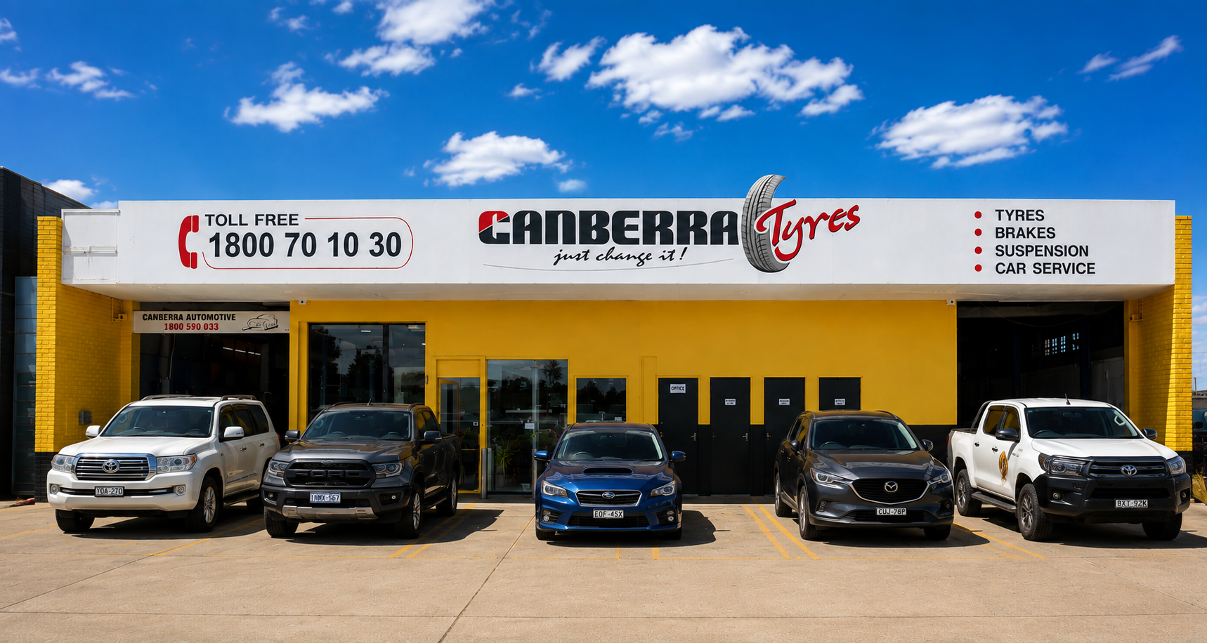 Canberra Tyres & Mechanical workshop in Fyshwick, yellow shopfront with customer cars parked out front